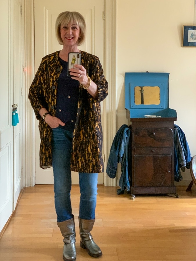 Golden and black jacket on jeans