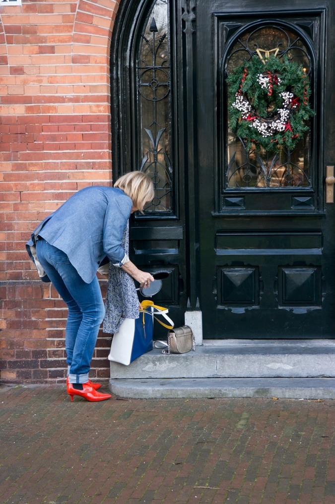 Denim jacket with orange boots and orange coat