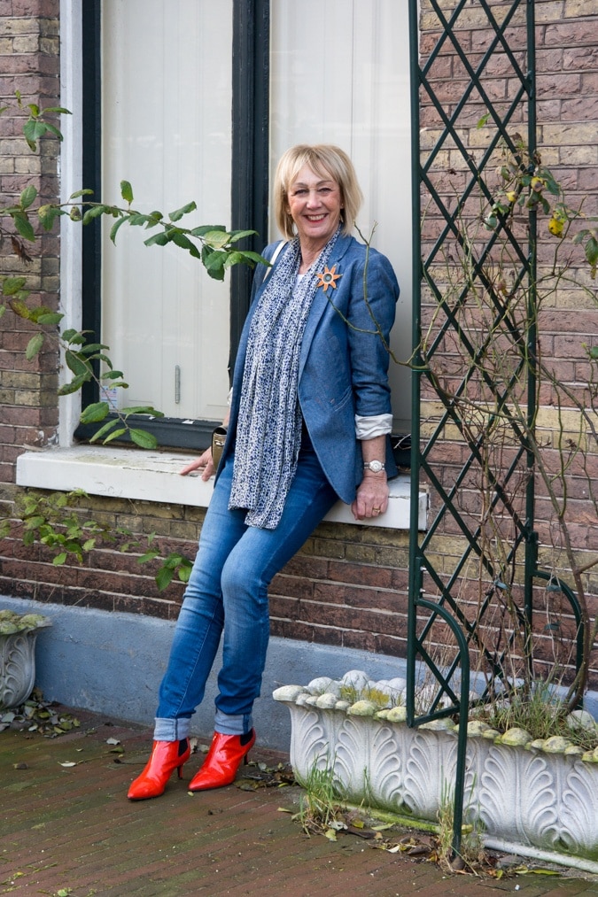 Denim jacket with orange boots and orange coat