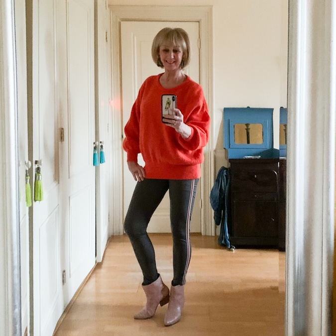 Orange jumper on green leggings