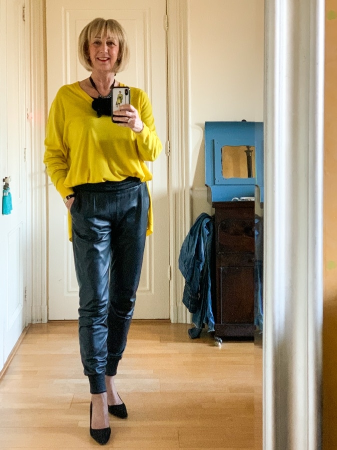 Yellow Kenzo jumper on leather jogging trousers