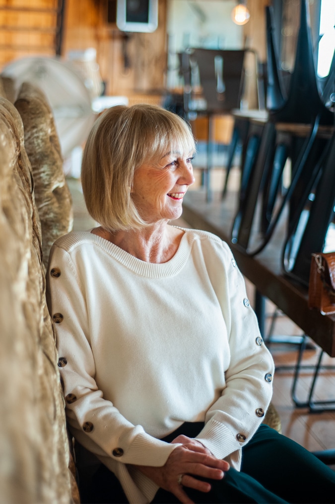 Cream jumper on wide green trousers