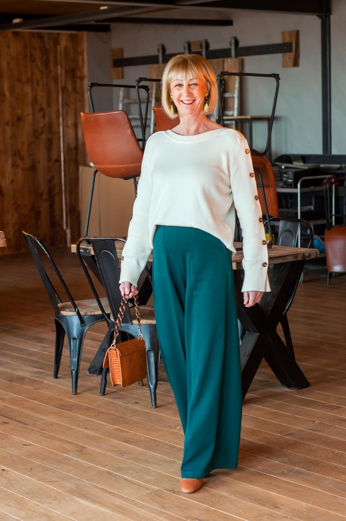 Cream jumper on wide green trousers