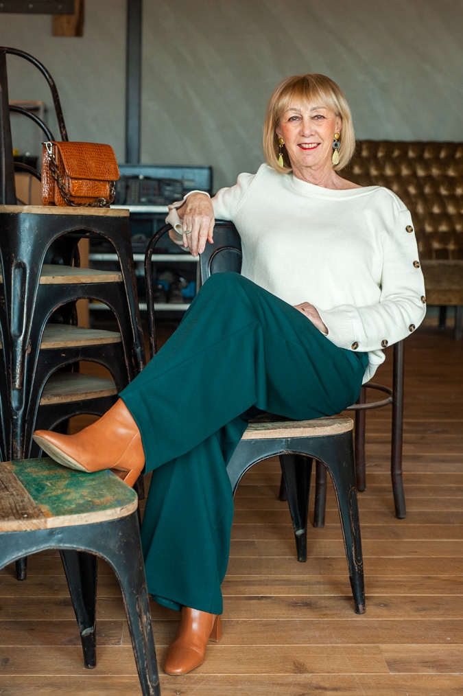 Cream jumper on wide green trousers