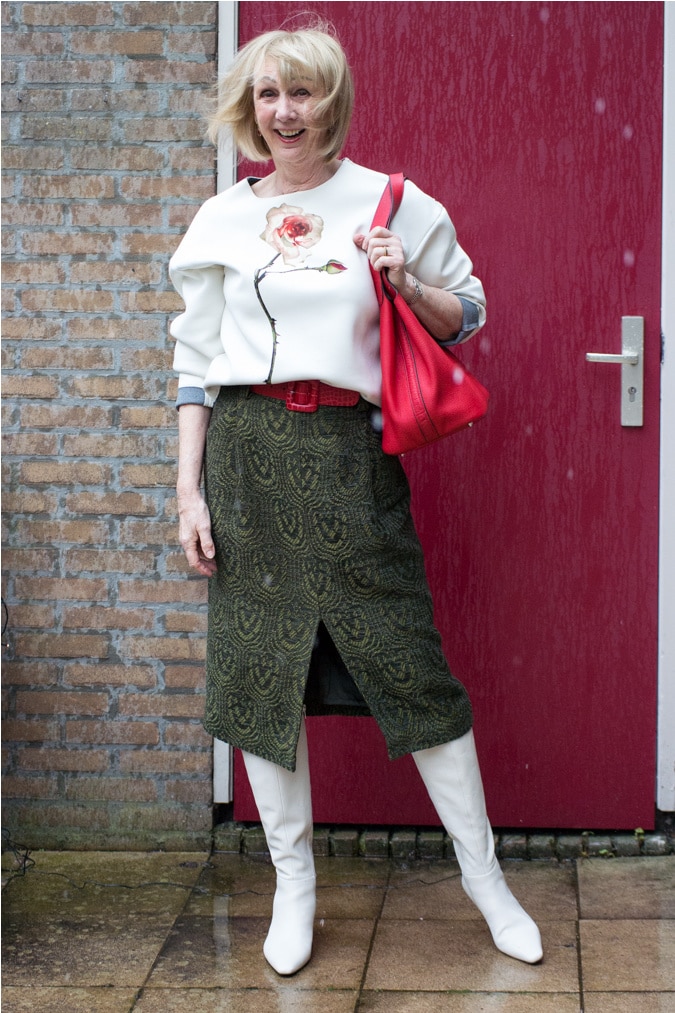 green midi skirt with a cream sweater