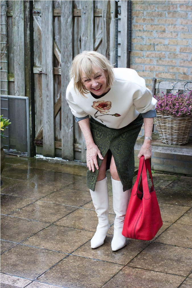 green midi skirt with a cream sweater