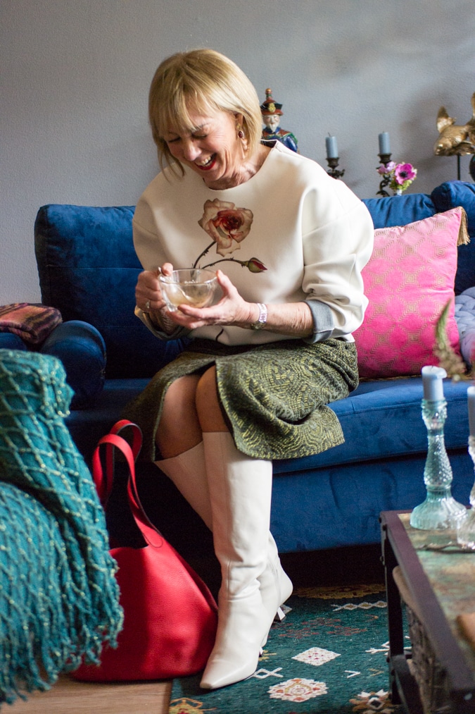 green midi skirt with a cream sweater