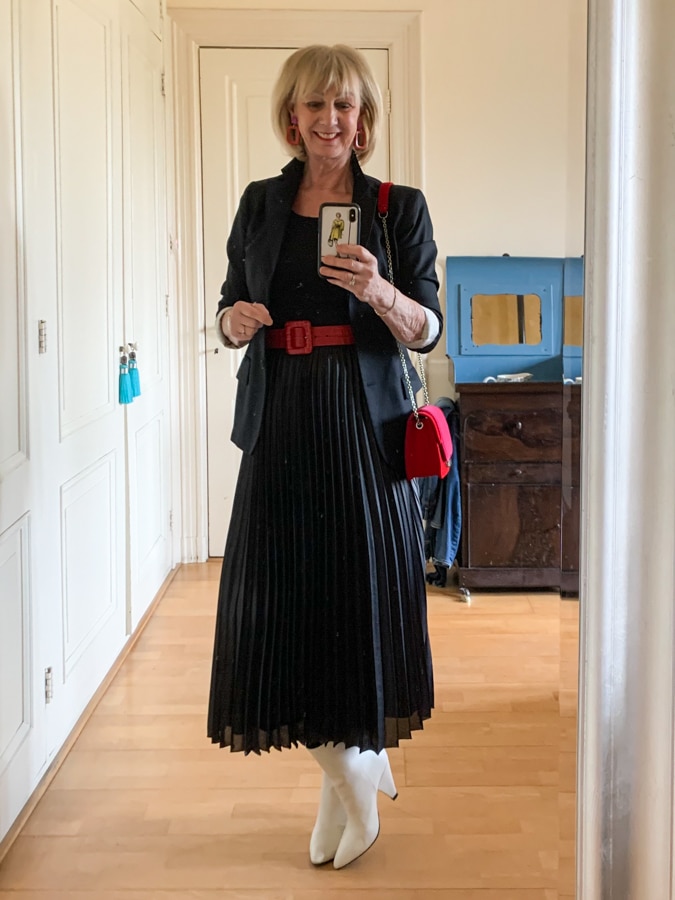 Black pleated skirt with red and pink accessories