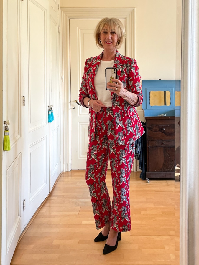Red trouser suit with tigers