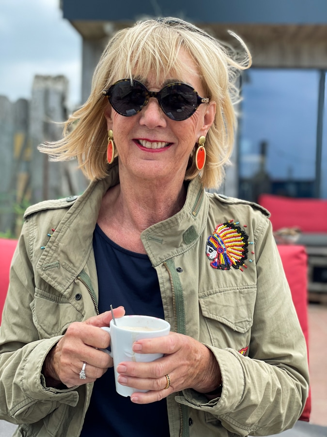 At the beach in Ralph Lauren jacket with earrings by Lara Design