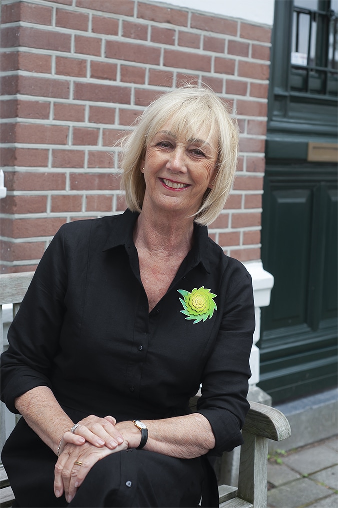 Black linen dress with green brooch by Sylvia Blickman