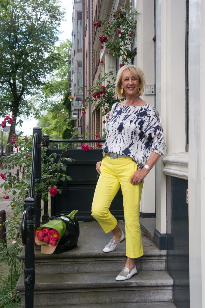 Blue and white top with yellow trousers