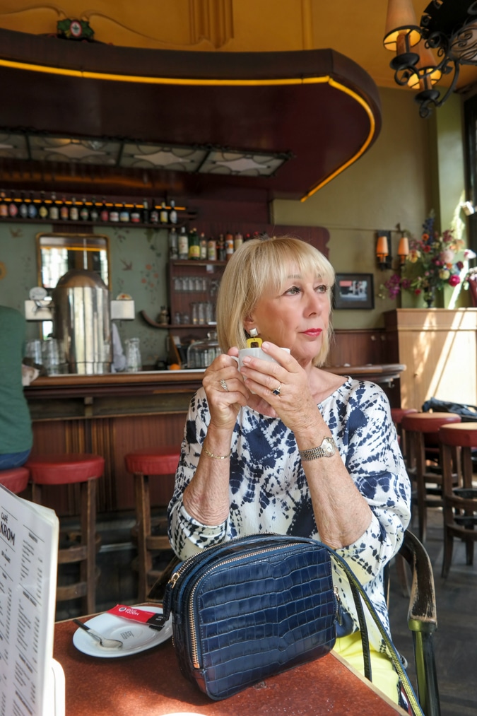 Blue and white top with yellow trousers
