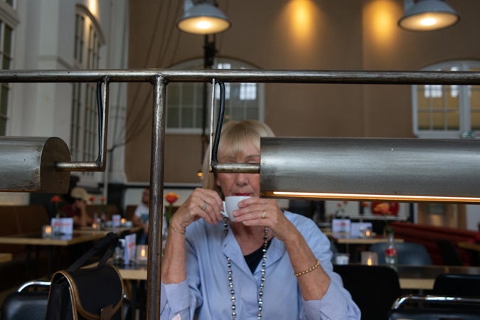 wide white trousers with long blue shirt