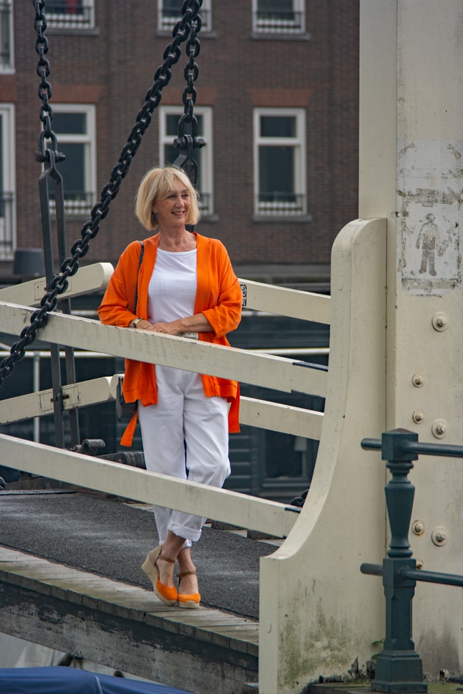 orange jacket with white trousers