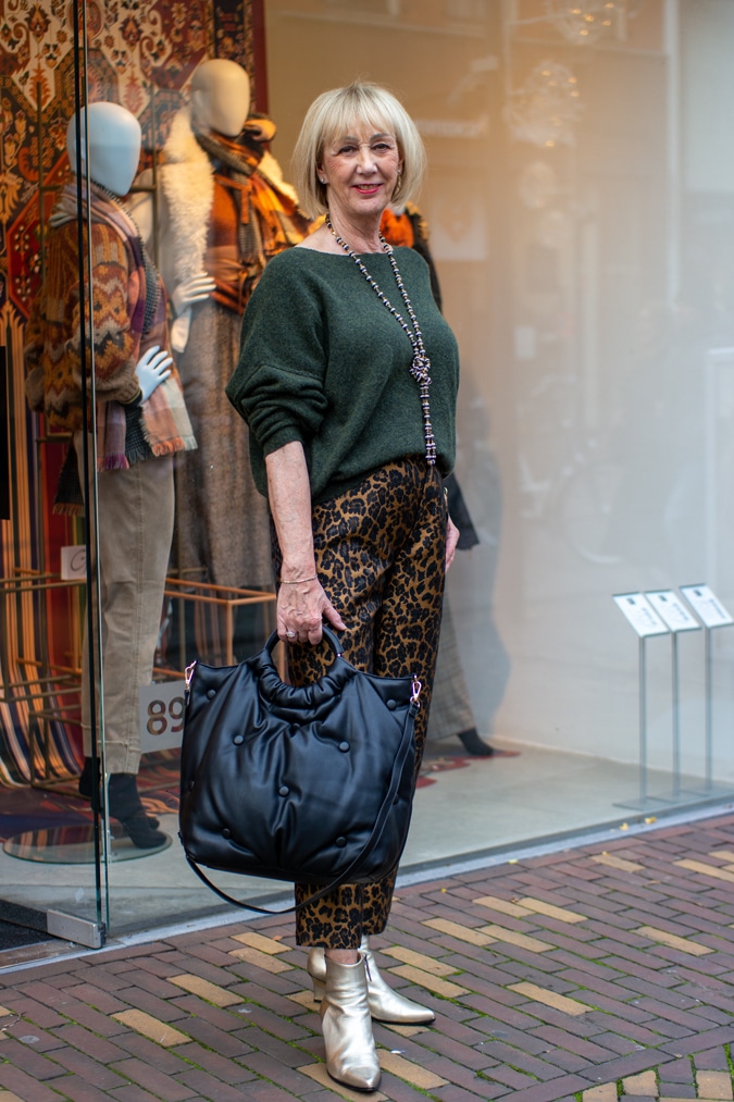 Green jumper on leopard print trousers