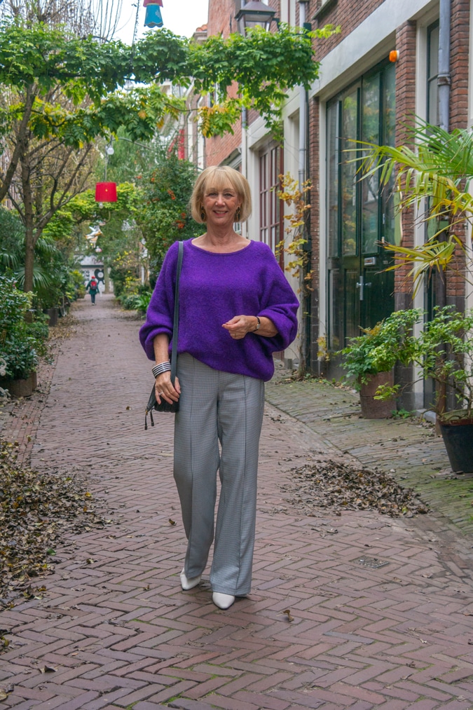 Houndstooth trousers with a purple jumper (sweater)