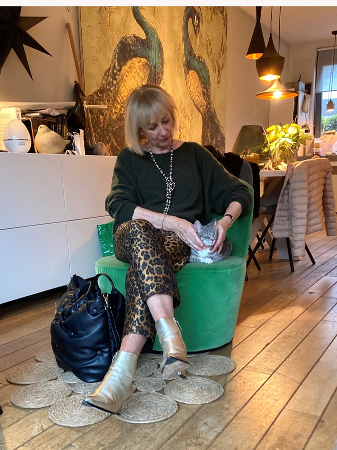 Green jumper on leopard print trousers