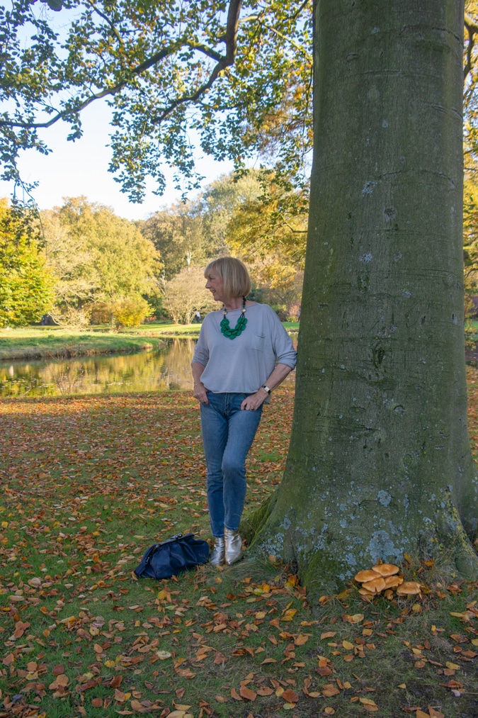 Simple grey top with a green statement necklace