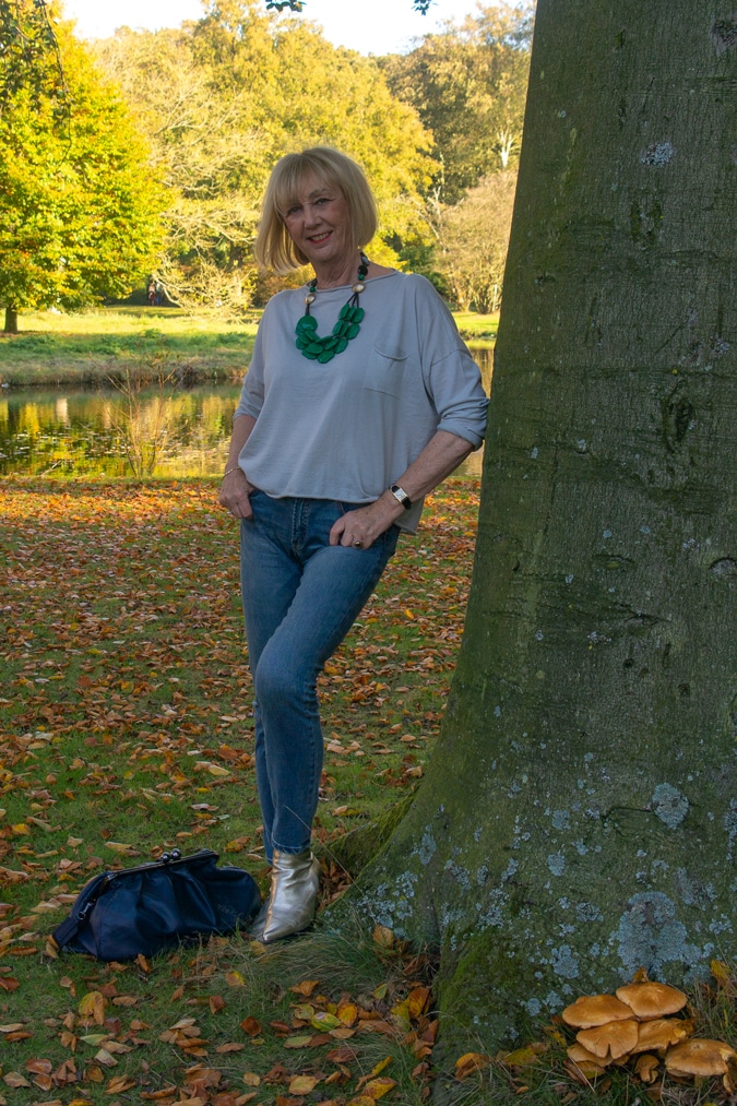 Simple grey top with a green statement necklace