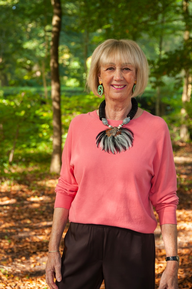 Pink jumper with statement necklace