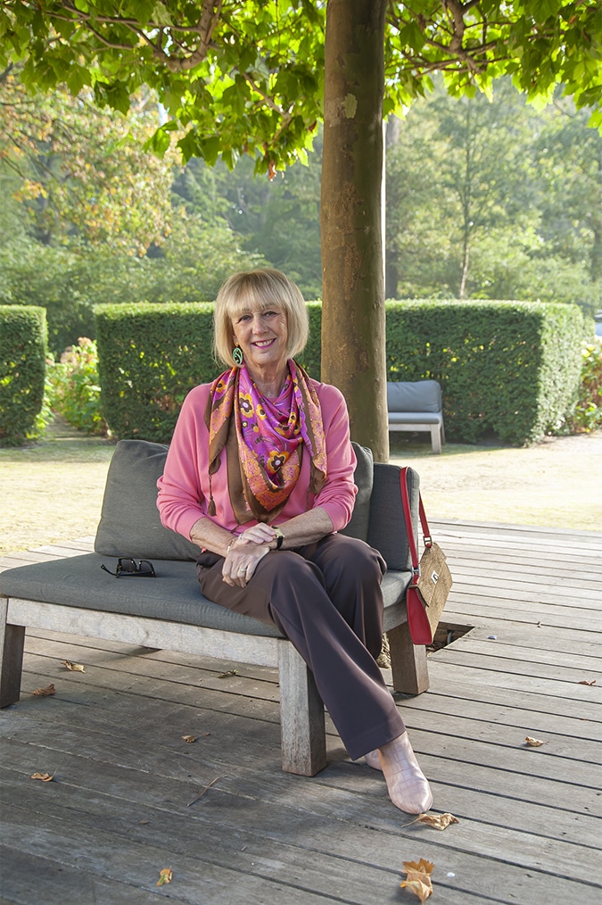 Wide brown trousers with a pink jumper