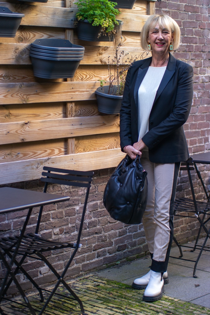 white combat boots and a black blazer