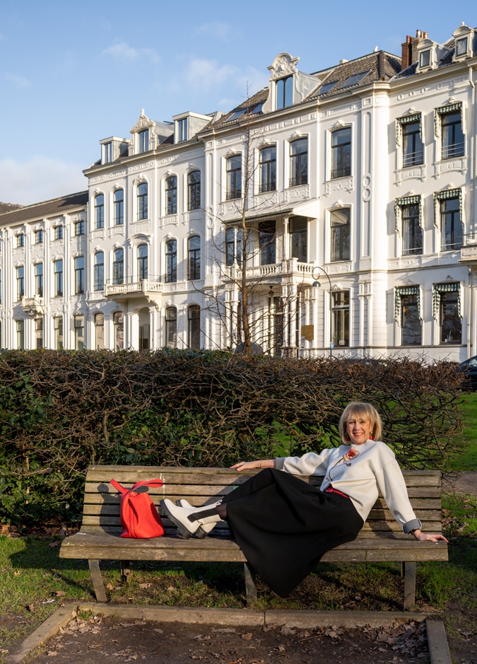 Flared black midi skirt styled in a modern way