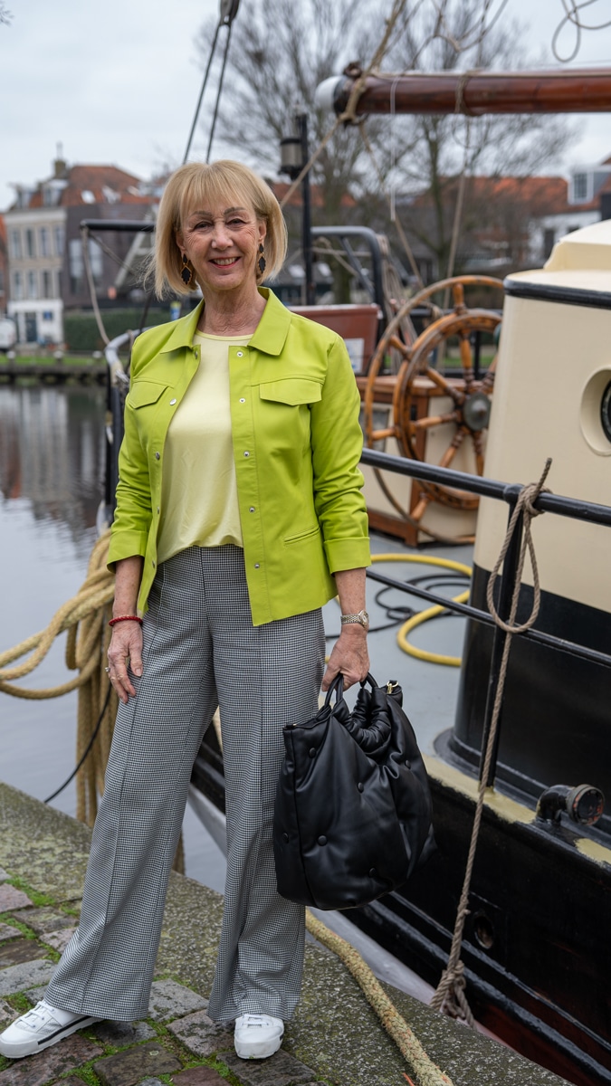 Lime leather jacket with houndstooth trousers