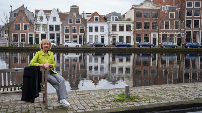 Lime leather jacket with houndstooth trousers