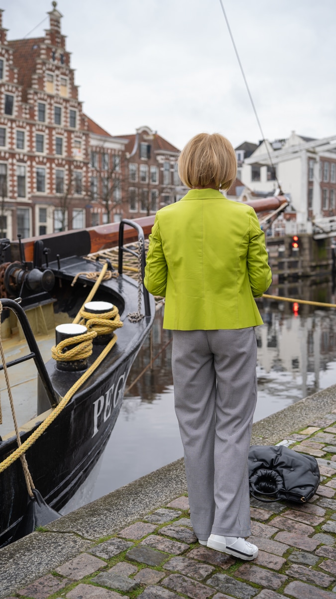 Lime leather jacket with houndstooth trousers