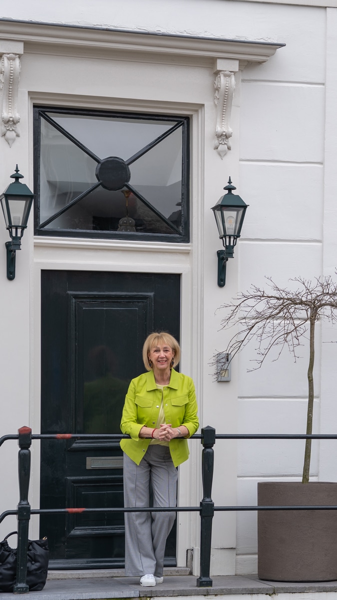 Lime leather jacket with houndstooth trousers