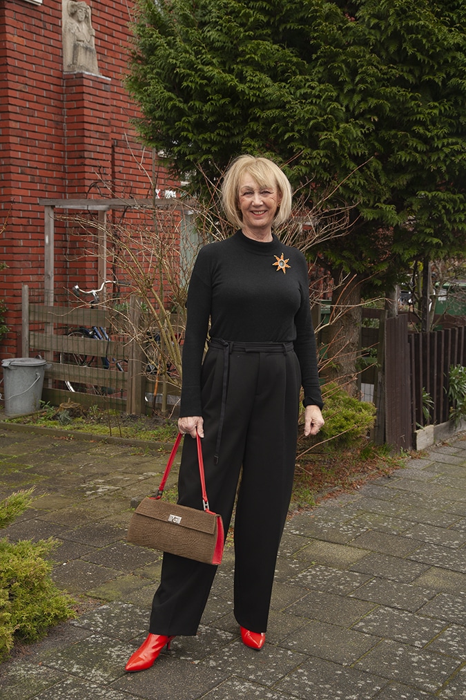 Wide black trousers with a black fitted top
