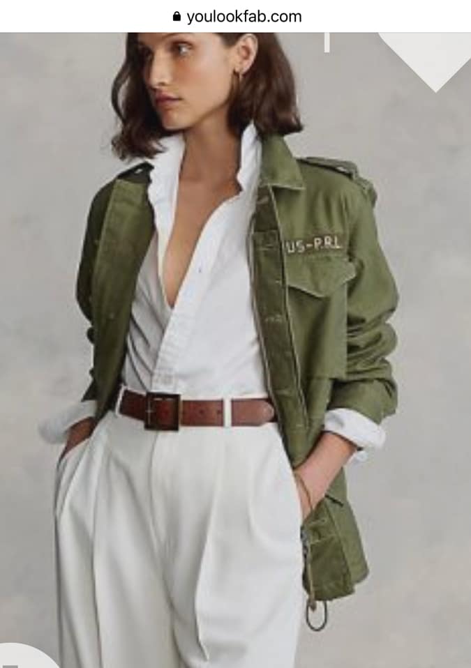 White trousers and shirt with a green jacket