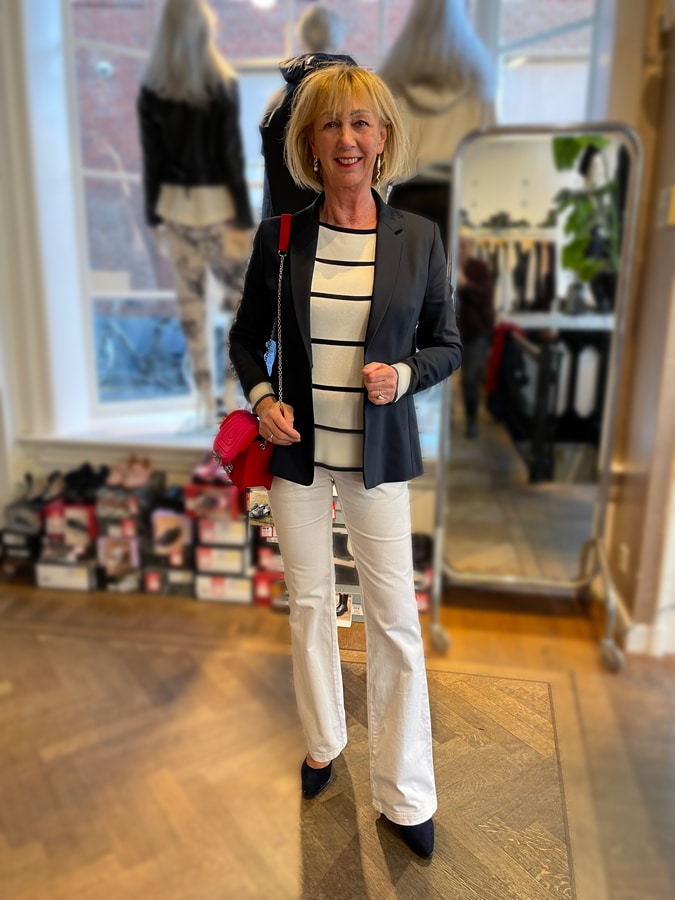 Navy blue blazer with white flared jeans