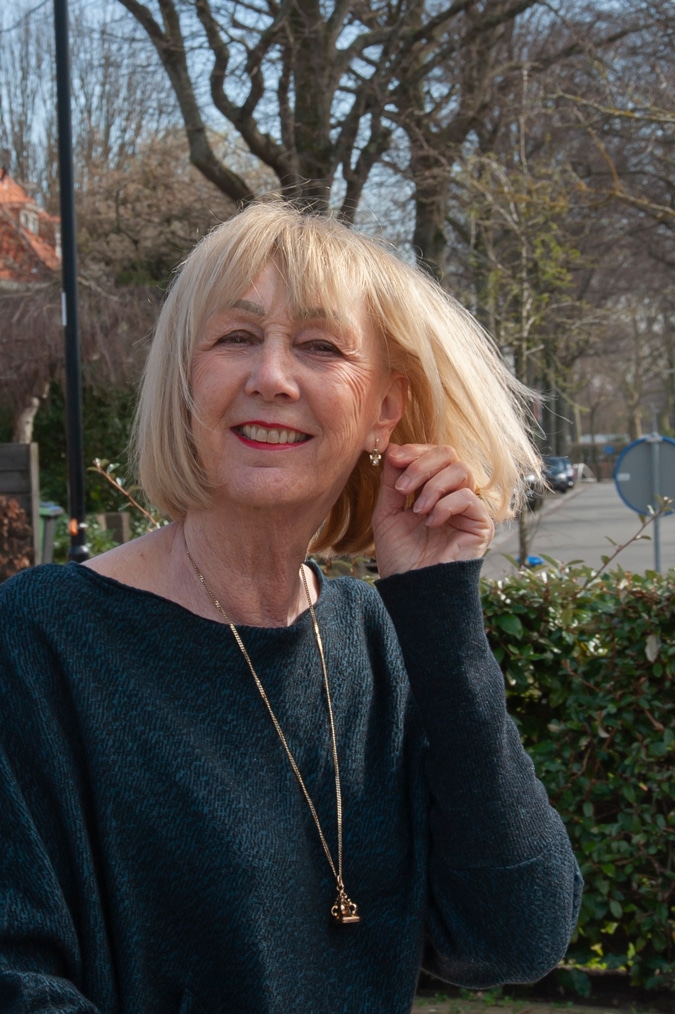 Navy blue jumper with cream trousers