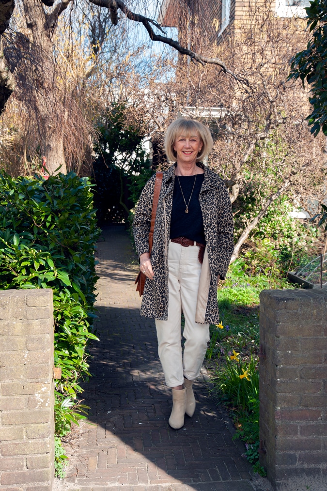 Navy blue jumper with cream trousers and a leopard coat
