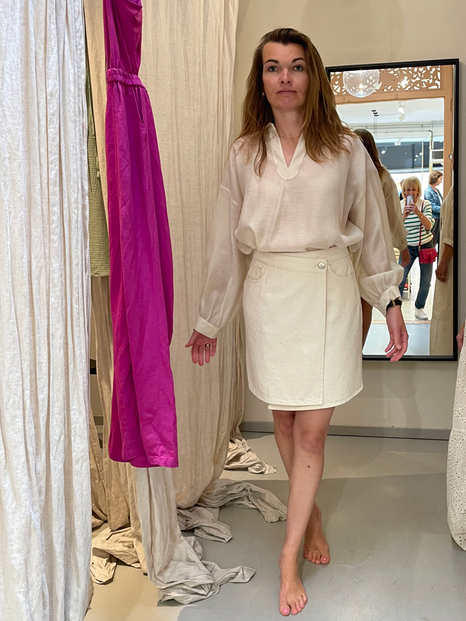 Anke in cream blouse and cream skirt
