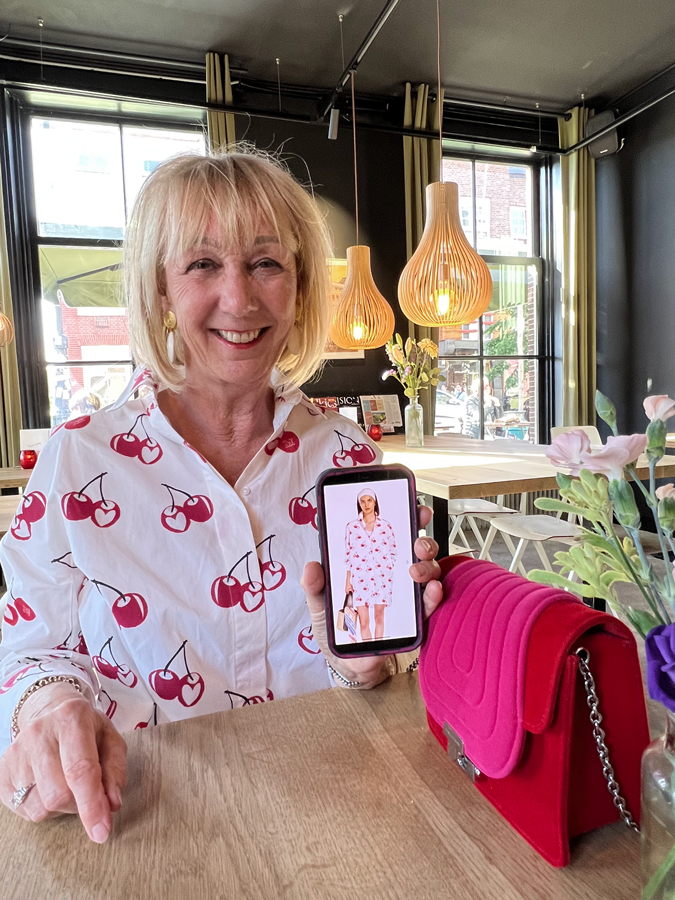 White cherry print dress by Max Mara plus the model