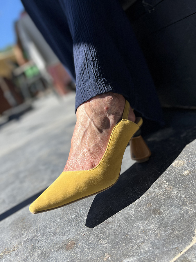 Yellow suede pumps