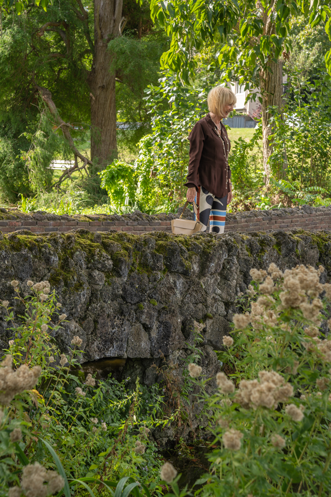 Arty print trousers with brown shirt
