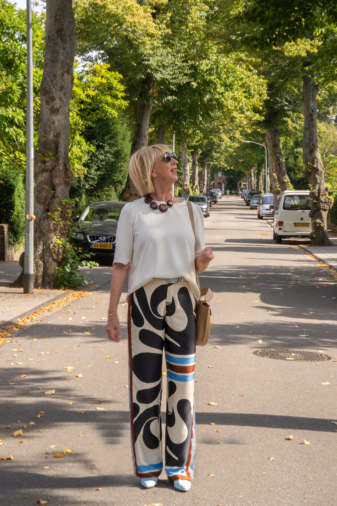 Arty print trousers with cream top