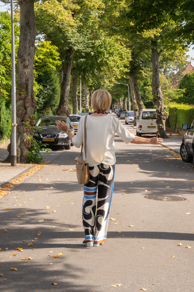 Arty print trousers with cream top