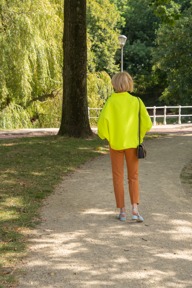 Neon yellow top with cognac coloured trousers