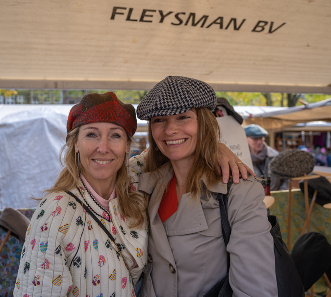 Sabine and Anke trying on caps