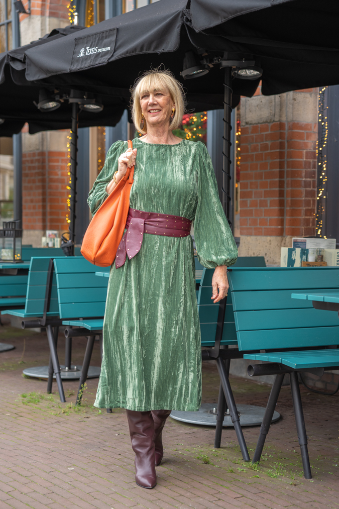 Green dress with burgundy belt and burgundy boots