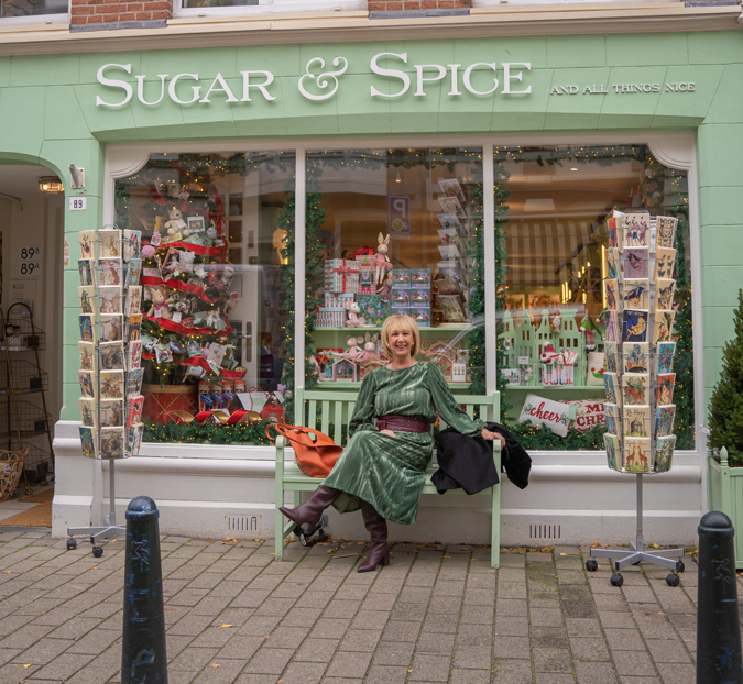 Green dress with burgundy belt and burgundy boots