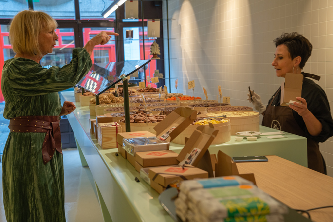 Green dress with burgundy belt and burgundy boots