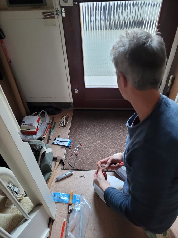 HarmJan fixing the front door draught