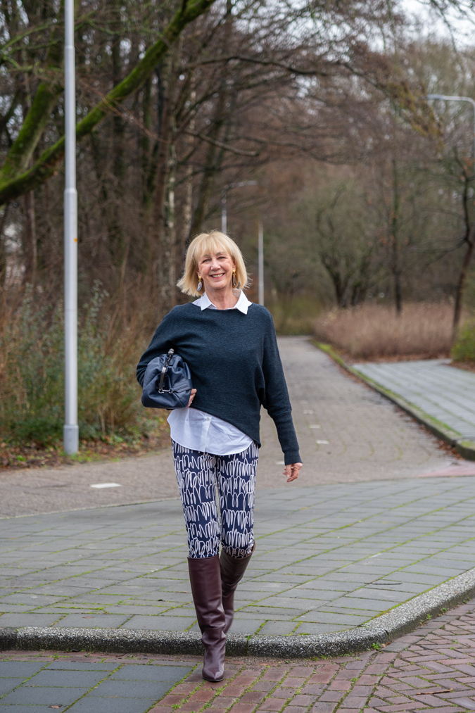 Patterned trousers and burgundy boots